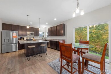Dining area featuring recessed lighting and light wood-style floors