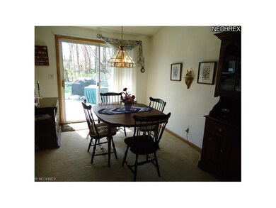 Dining room with sliding glass door to deck and ba