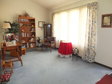 Living room with vaulted ceiling.