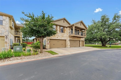 Multi unit property with stone siding, a balcony,