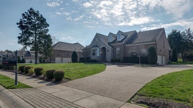 Three car side entry garage with ample parking.  Mature landscaping, irrigation system & gas lantern.  