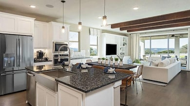 Kitchen with stainless steel appliances, dark woo