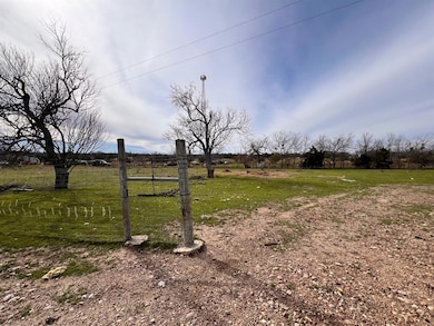 View of yard with a rural view