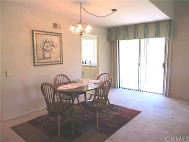 Dining room with slider to private patio