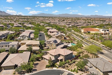Aerial view of residential area featuring a mounta