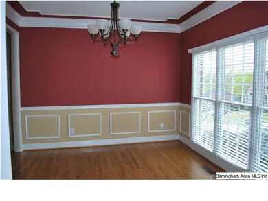 Formal Dining Room with hardwood, triple window, w