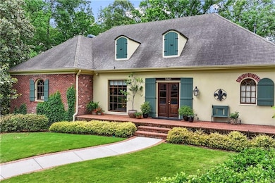 View of front of house with a shingled roof, a fro