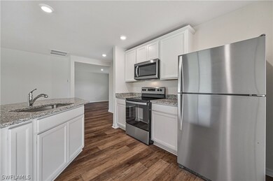 Kitchen featuring dark hardwood / wood-style floor