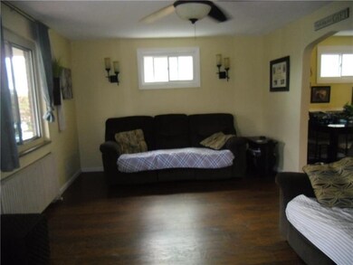 Living room with new Laminate flooring and arched 