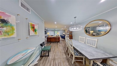 passing downstairs 4th br/3rd bath into living