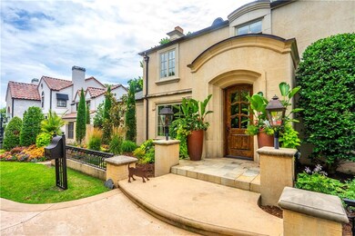 Charming entrance flanked with gas lanterns