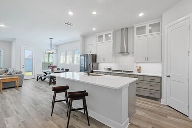 Kitchen with light hardwood / wood-style flooring,