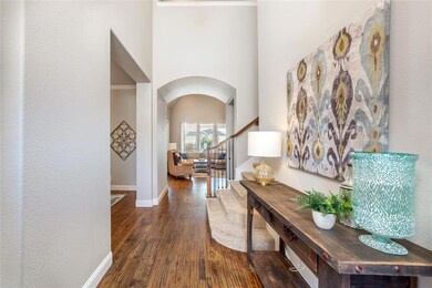 Gorgeous entrance w hand scraped wood floors and h