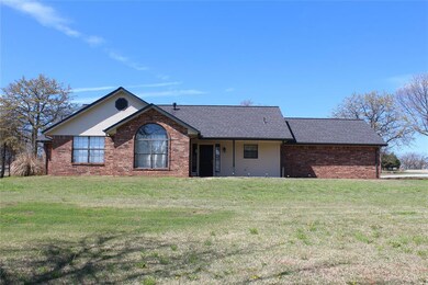 Single story home featuring a front yard