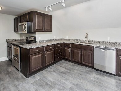 The eat-in kitchen has all new...
