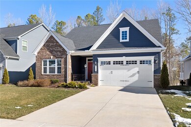 Craftsman-style house featuring a front yard and a