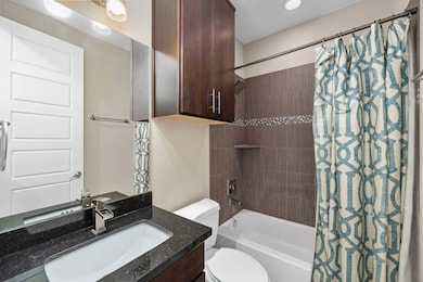 Full bathroom located on the 1st floor with a tub