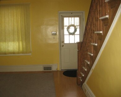 View of front door entrance from kitchen.