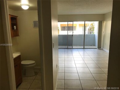 half bath and living room area with balcony view.