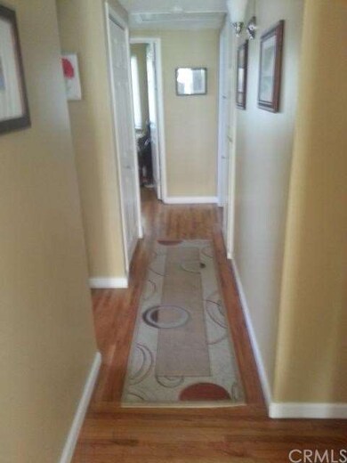 Hallway with wood floors