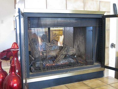 Living Room. Unique 3 sided fireplace!