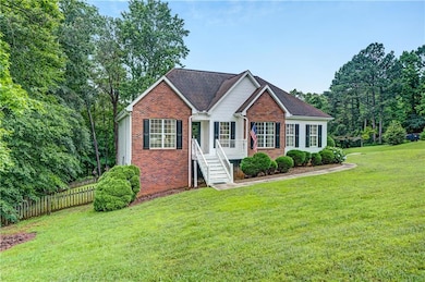 View of front of property featuring brick siding and a shingled roof