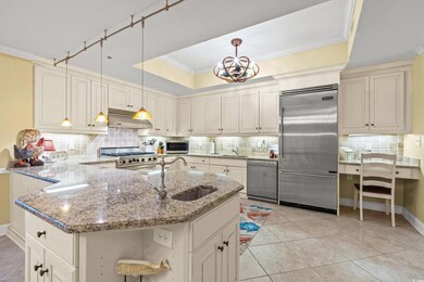 Kitchen featuring light tile patterned flooring, l