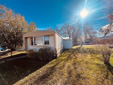 View of home's exterior featuring a lawn