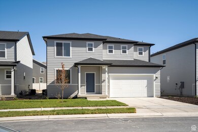 View of front of property featuring concrete driveway, a shingled roof, an attached garage, and a front lawn