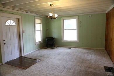 Living room, exposed joists in ceiling.