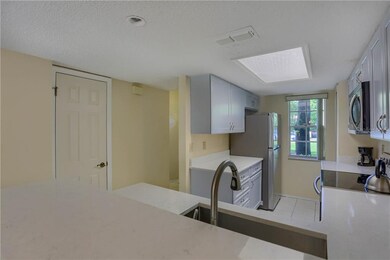 Newly updated kitchen with quartz countertops, sof