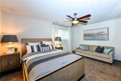 Bedroom featuring carpet floors and ceiling fan