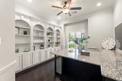 Showcases a Well-lit Home Office with Built-in Woo