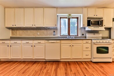 Dishwasher, gas range, and microwave included.