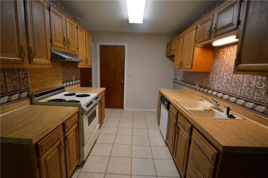 Kitchen; door at far end leads to the garage.