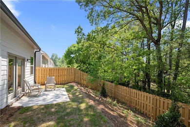 View of backyard featuring a fenced backyard and a