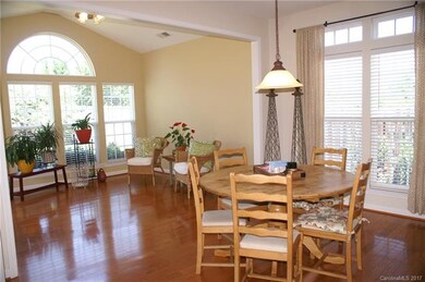 Large windows throughout home and hardwood floors 