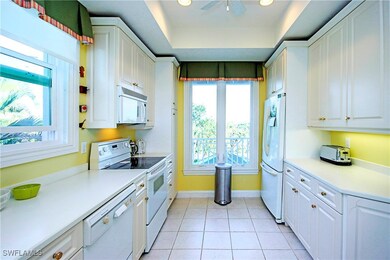 Kitchen featuring white cabinets, tiled patterned