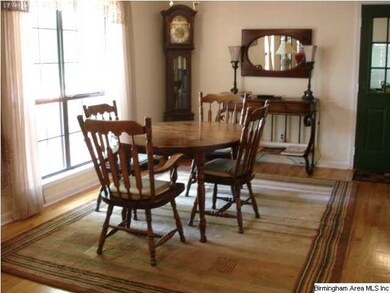 a roomy dining area open to kitchen