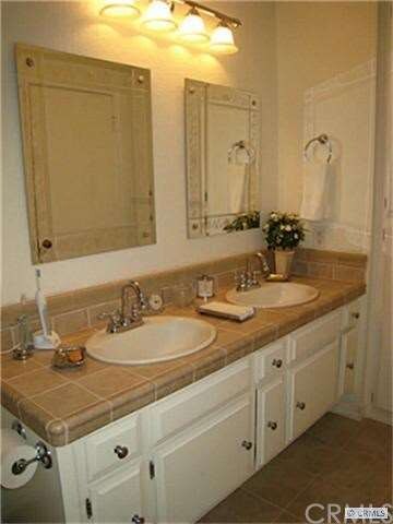 Remodeled bathroom with dual sinks, customized thr