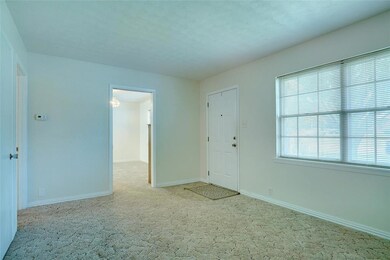 LIVING AREA GREETS YOU AS YOU ENTER IN...