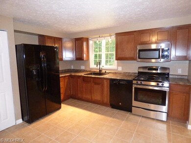 Kitchen with appliances to stay.