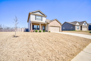 View of front of property featuring an attached ga