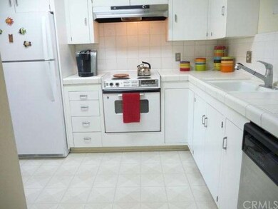 Ceramic tile counters, refrigerator included in th