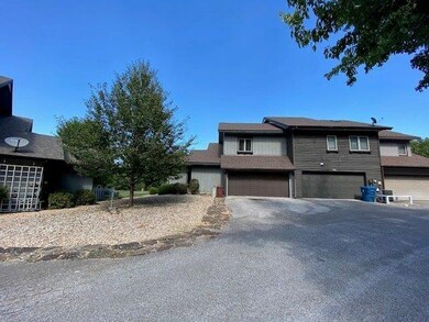 The garage opens to the back. 2 car garage door with room for one car and golf cart or other toys will fit there