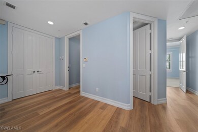 Unfurnished bedroom featuring hardwood / wood-styl