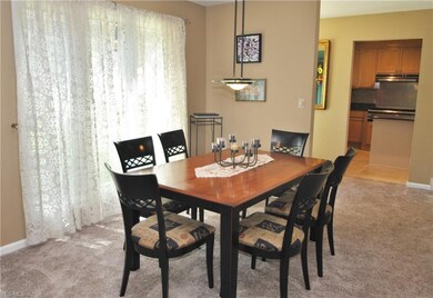 The informal dining room has a large window that l