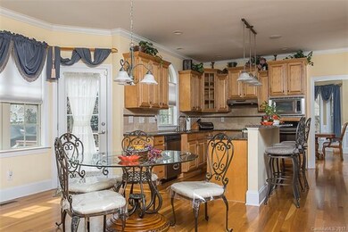 Enjoy Gathering in the generously- sized kitchen a
