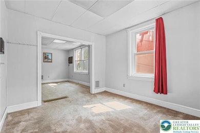 To the right of the entrance, this room can either