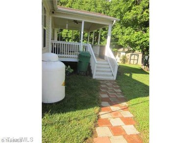 Other. Walk way leading to mans best friend a covered back porch and a rocker!